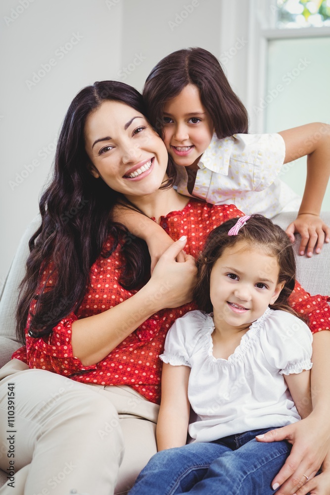 Portrait of smiling mother and daughters Portrait of smiling mother and daughters