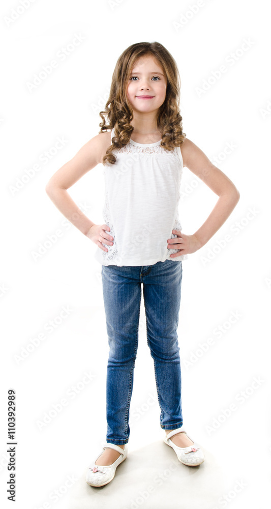 Cute smiling little girl in jeans isolated Cute smiling little girl in jeans isolated