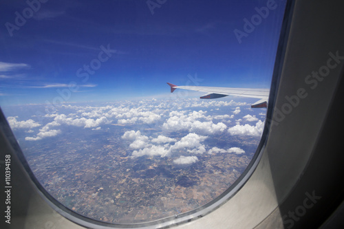 Looking through window aircraft during flight in wing with top view 