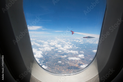 Looking through window aircraft during flight in wing with top view

