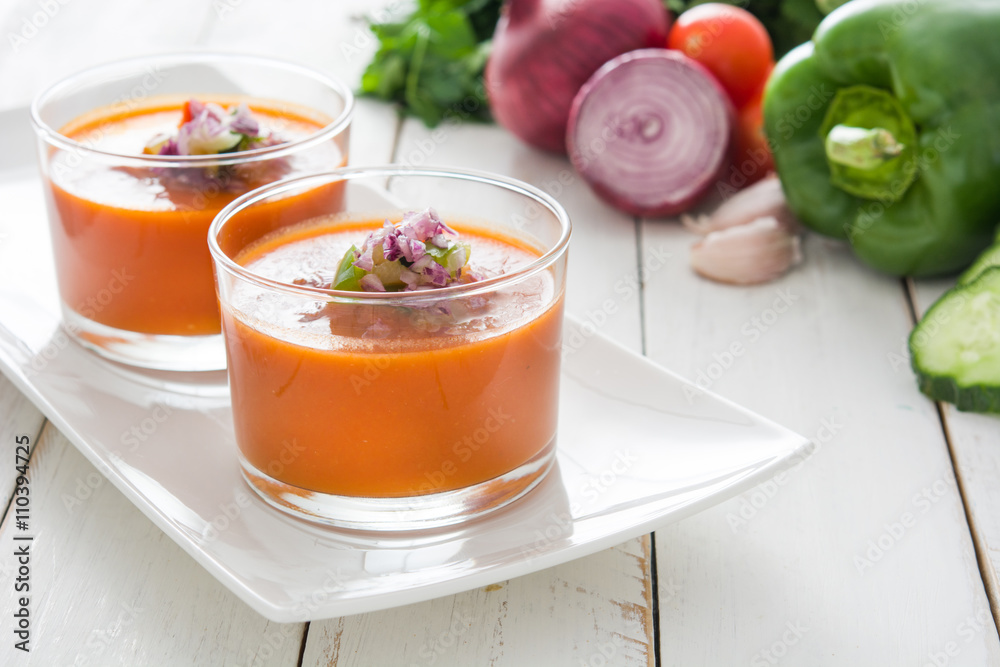 Gazpacho soup and ingredients on white wooden background
Gazpacho soup and ingredients on white wooden background