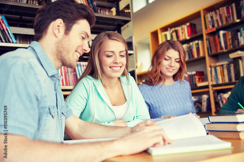 students with books preparing to exam in library students with books preparing to exam in library