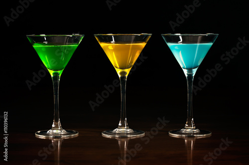 Three glasses of different alcohol cocktails