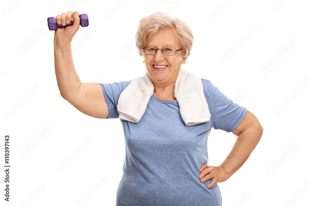 Mature lady exercising with a dumbbell Mature lady exercising with a dumbbell