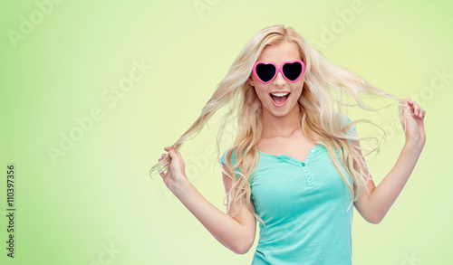 happy young blonde woman or teenager in sunglasses © Syda Productions