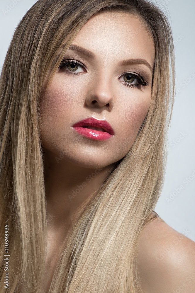 Closeup portrait of blonde girl on white background Closeup portrait of blonde girl on white background