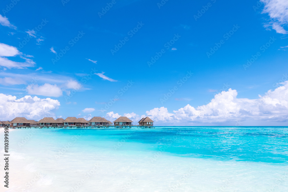 Beach with water bungalows at Maldives.