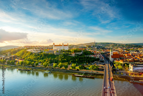 Canvas Print Bratislava aerial cityscape view on the old town with Saint Martin's cathedral, castle hill and Danube river on the sunset in Slovakia