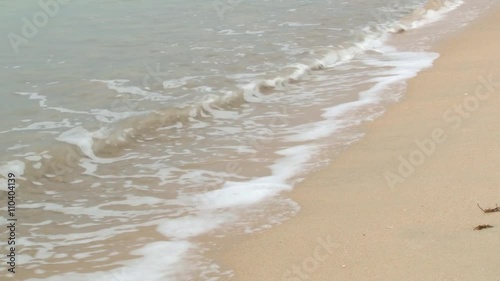 Wave comes to the sandy beach in Trincomalee, Sri Lanka. photo