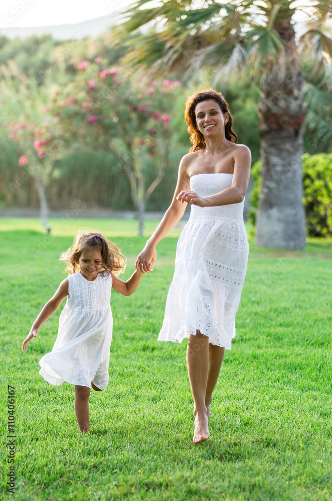 Mother and daughter are resting in the country side.