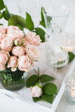 vintage wedding table decorations with roses, candles, cutlery a