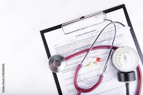 Medical concept of medical report with stethoscope isolated on w photo