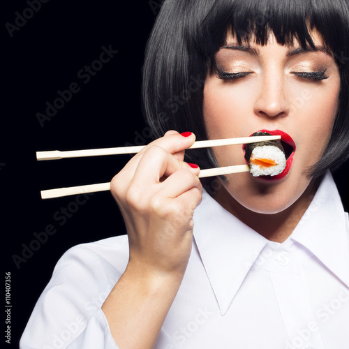 Young woman in wig eating sushi