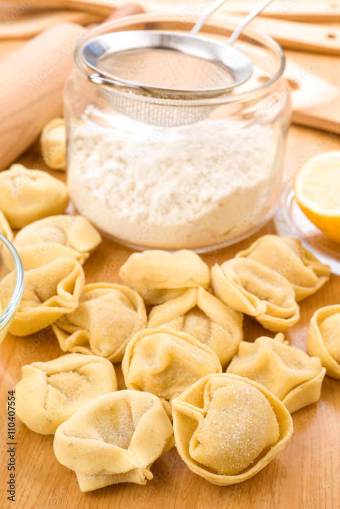 tortellini uncooked on wooden tortellini uncooked on wooden
