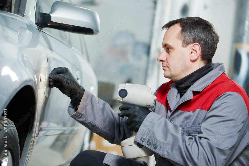 colourist man compare color sample with car paint colourist man compare color sample with car paint