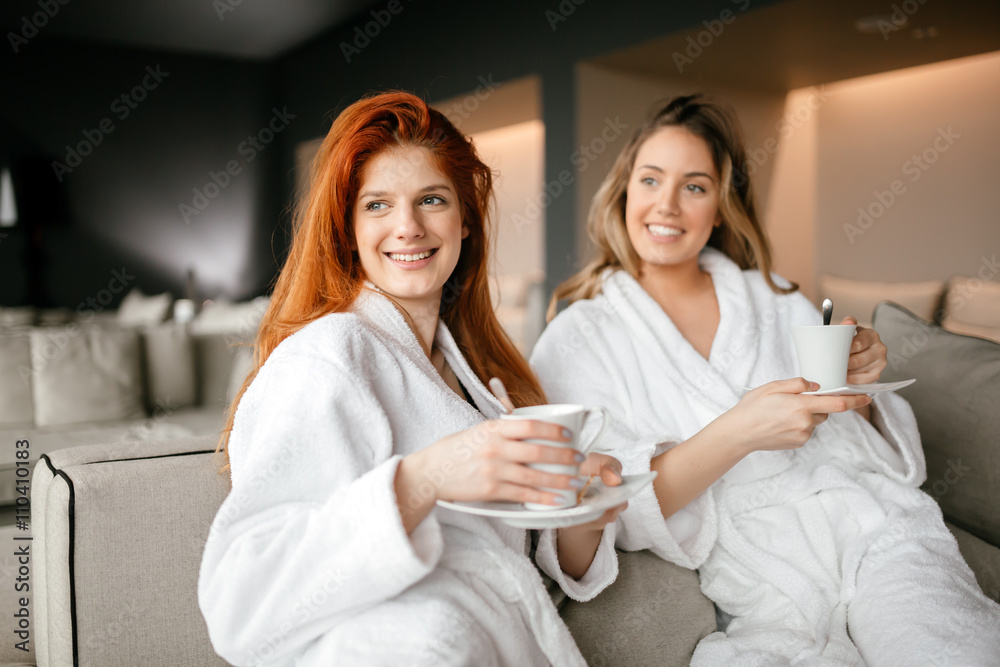 Fotografie Women relaxing and drinking tea