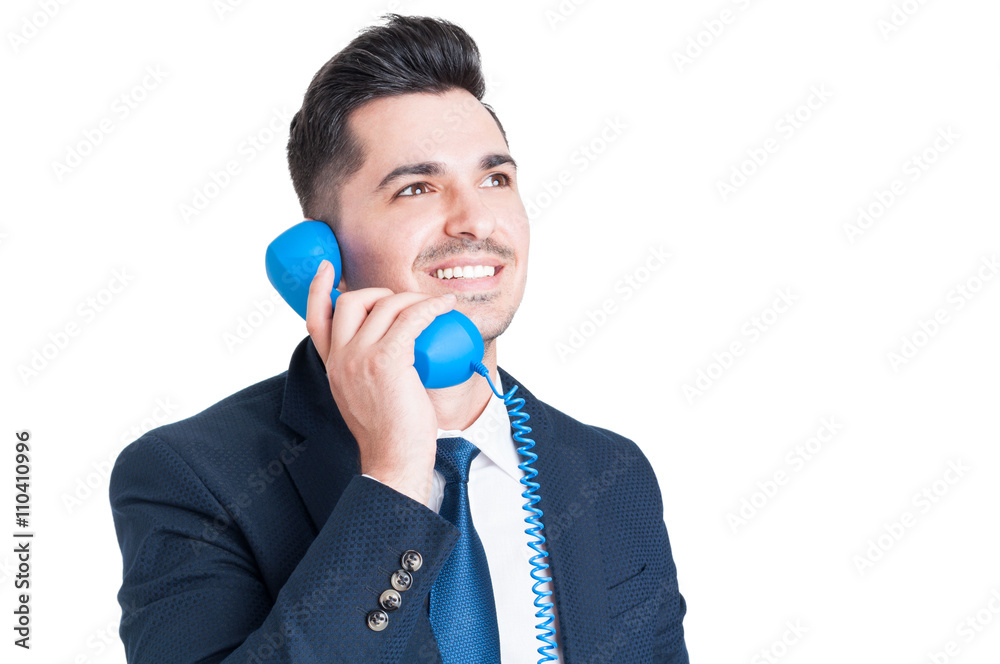 Close-up of successful happy businessman talking on retro phone Close-up of successful happy businessman talking on retro phone