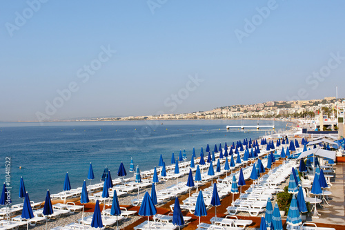 Blue morning on the beach in Nice, France on the French Riviera Mediterranean coast. Horizontal with copy space for text © Richard McGuirk
