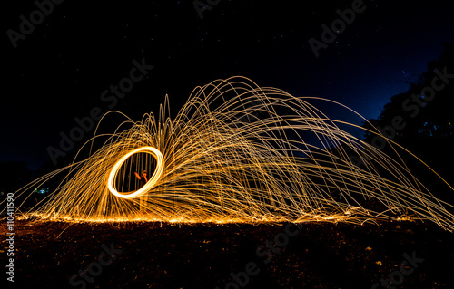 art light of fire spinning from metal wool