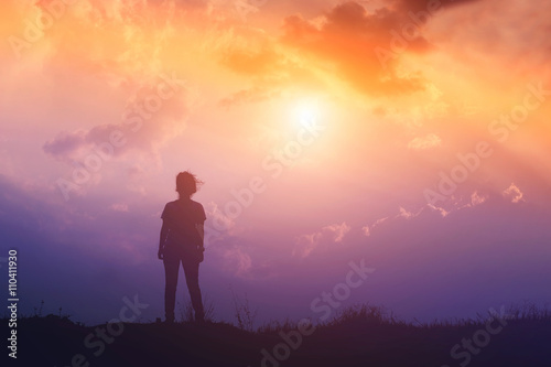 Silhouette of woman and sunset time