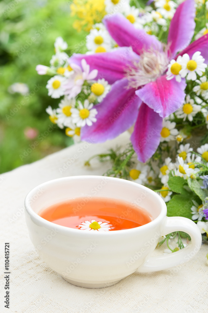 tea with chamomile and garden flowers tea with chamomile and garden flowers