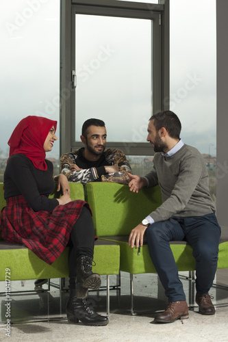 Group of students are hanging out in university hall, mixed-race