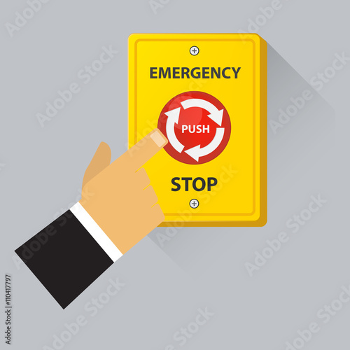 Hand pushing emergency red stop button