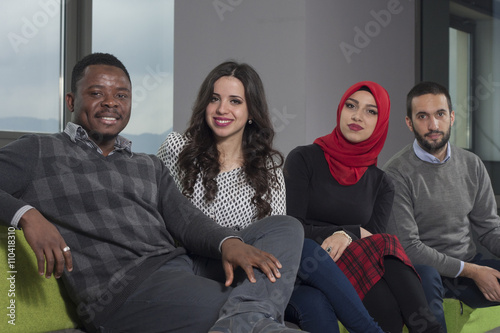 Group of students are hanging out in university hall, mixed-race