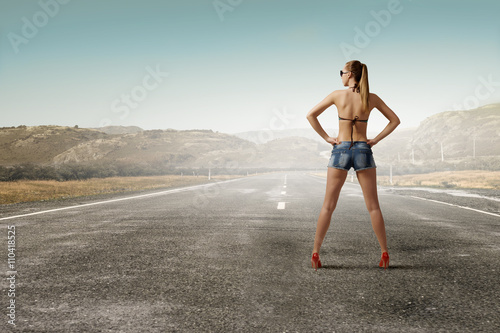 Hitch hiker woman on road