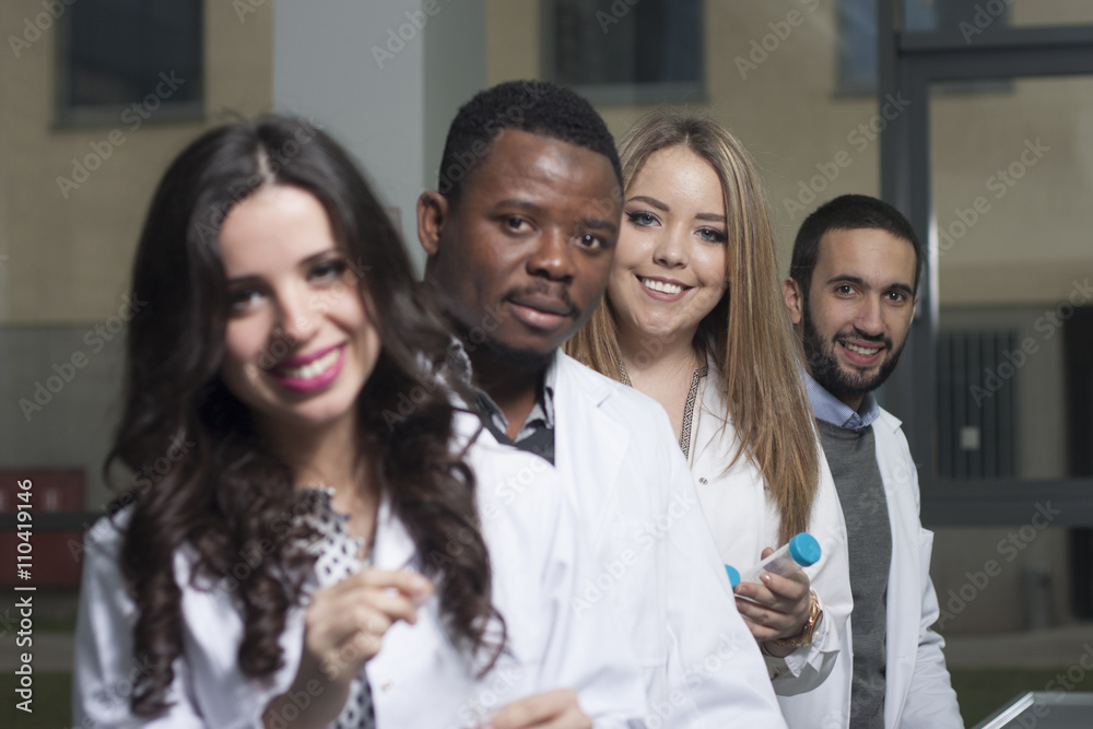 Group of young medical workers are working in lab as lab technic Group of young medical workers are working in lab as lab technic
