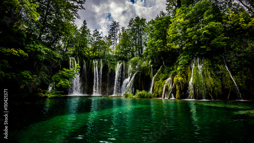 view of beautiful waterfall in the forest 