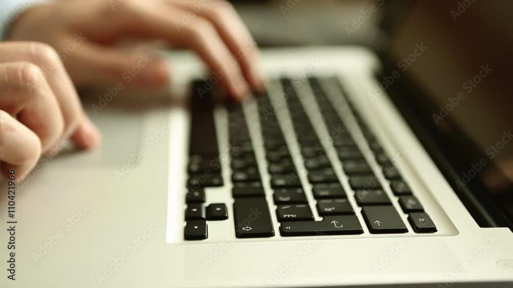 Close up of businessman hands typing on laptop computer on wooden table Close up of businessman hands typing on laptop computer on wooden table