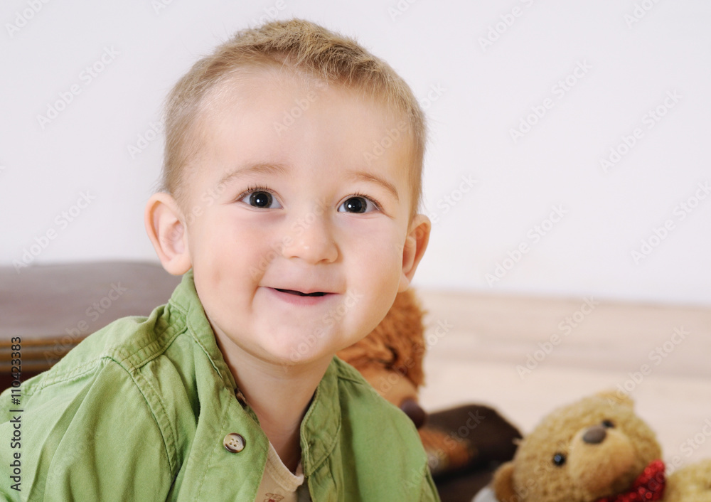 portrait of little cute smiling boy with his toy on background portrait of little cute smiling boy with his toy on background