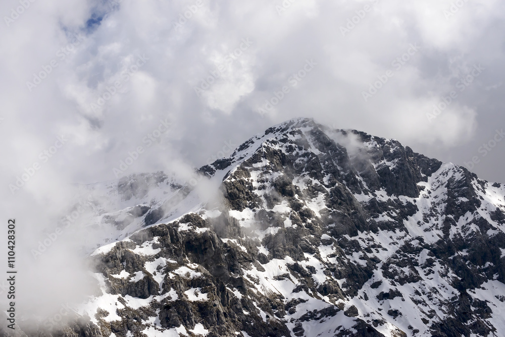 summit of Tre Signori peak among clouds, Orobie