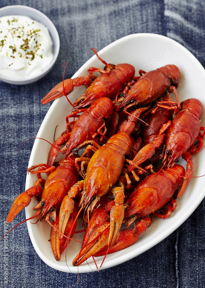 Boiled red crayfish with sauce . top view Boiled red crayfish with sauce . top view