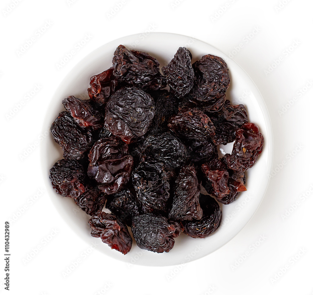 Bowl of raisins isolated on white, from above Bowl of raisins isolated on white, from above