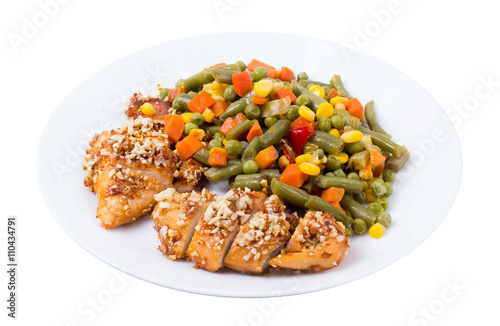 Mixed vegetables in a plate and chicken on a