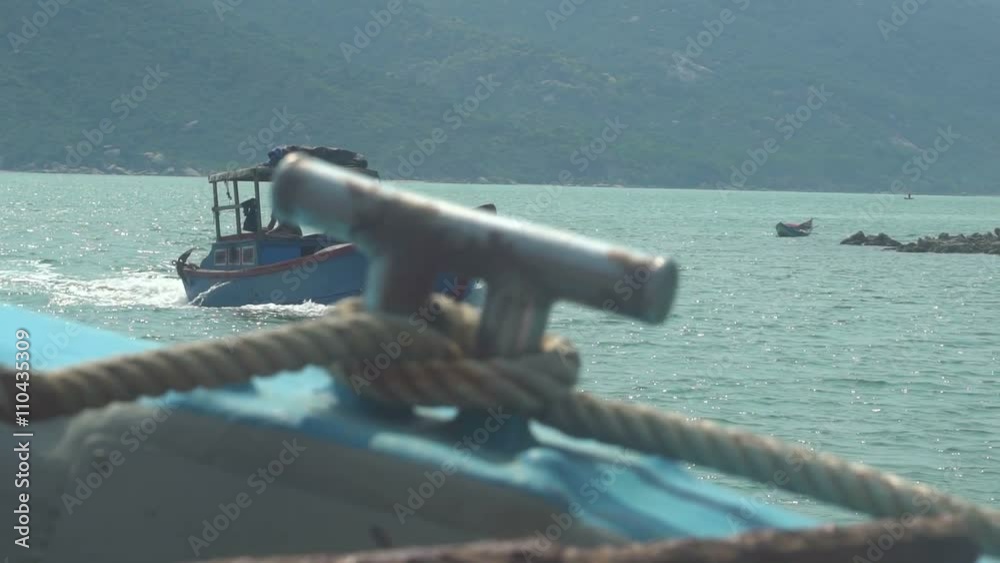 fisherman on a boat in a turquoise bay 3 fisherman on a boat in a turquoise bay 3