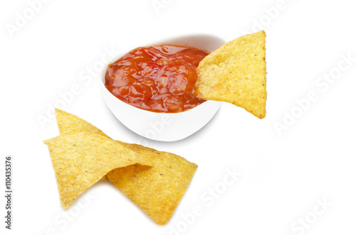 nachos and tomato dip on the white