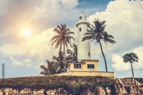 Lighthouse and palm trees in the town of Galle, Sri Lanka