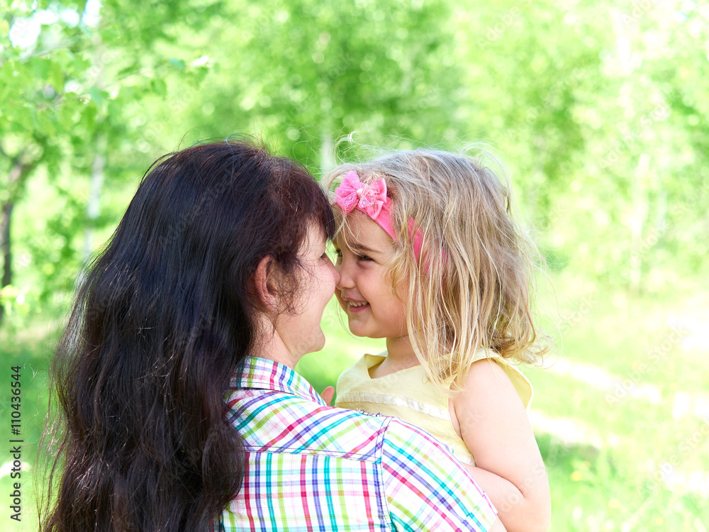 mother playing with her little daughter on nature mother playing with her little daughter on nature