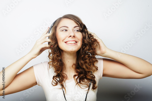 Woman with headphones listening music