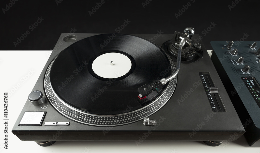 Turntable playing vinyl close up with needle on the record Turntable playing vinyl close up with needle on the record