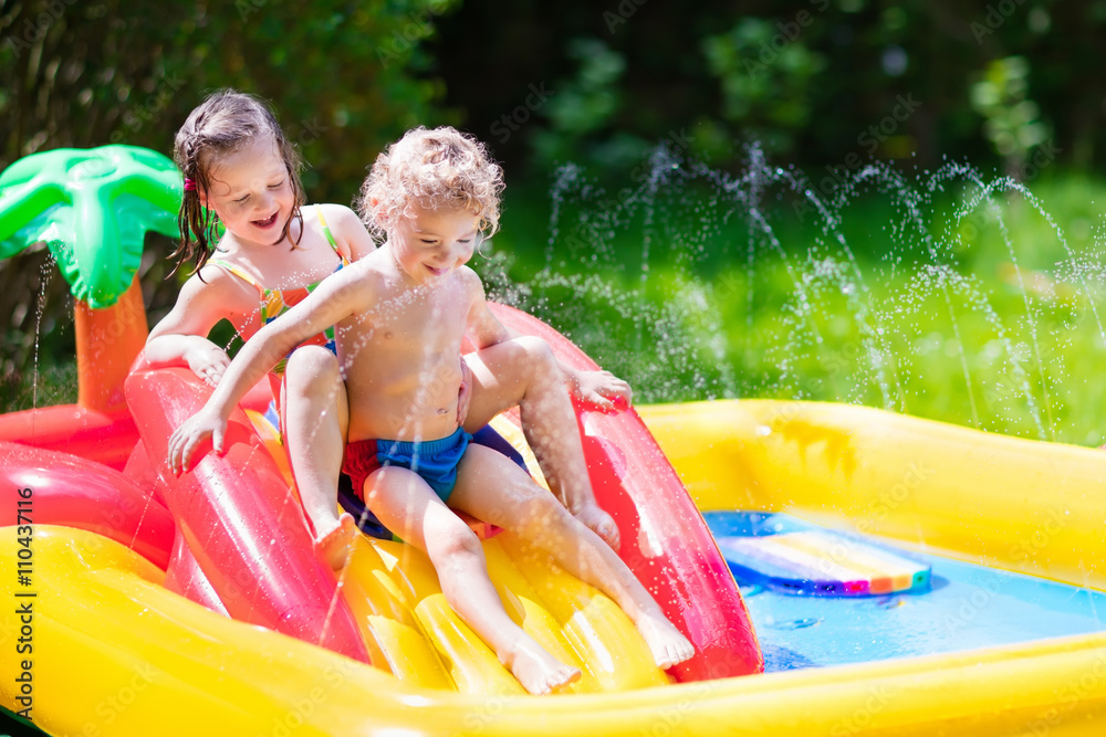 Kids playing in inflatable pool