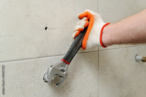 Worker unscrew the nut.