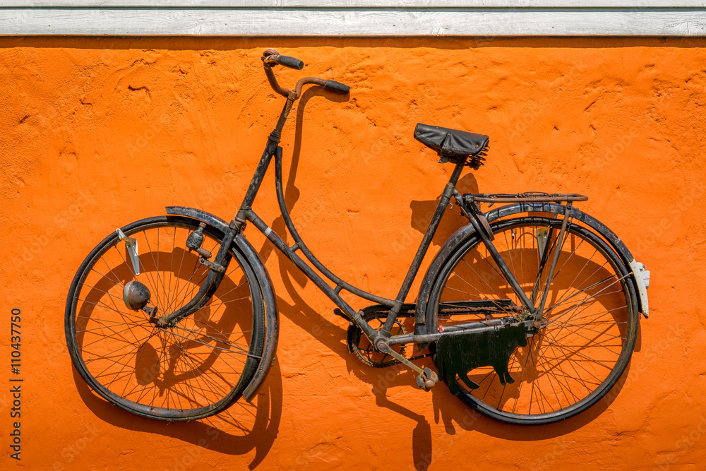 Vintage bike hanging on a wall