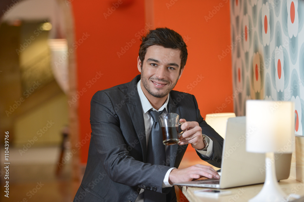 Handsome business man in restaurant talking on the phone Handsome business man in restaurant talking on the phone