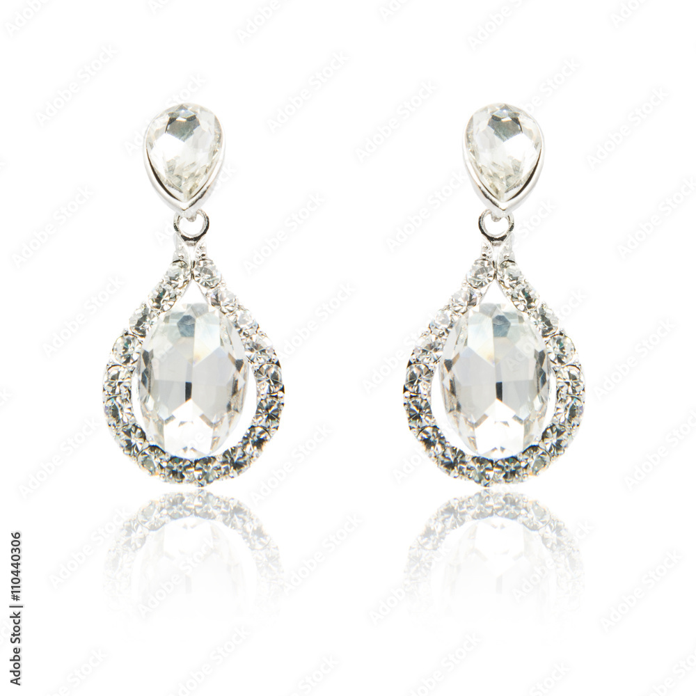 Pair of diamond earrings isolated on white