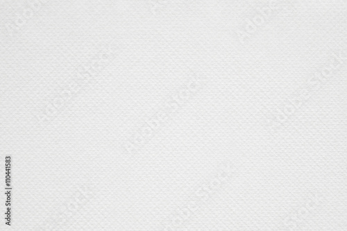 Dotted, white paper texture or background.