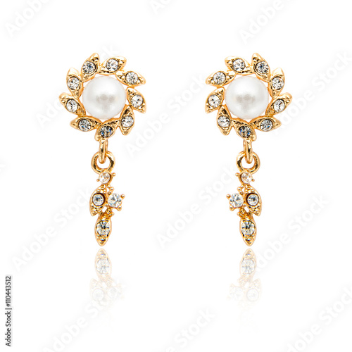 Pair of diamond and natural pearls earrings isolated on white